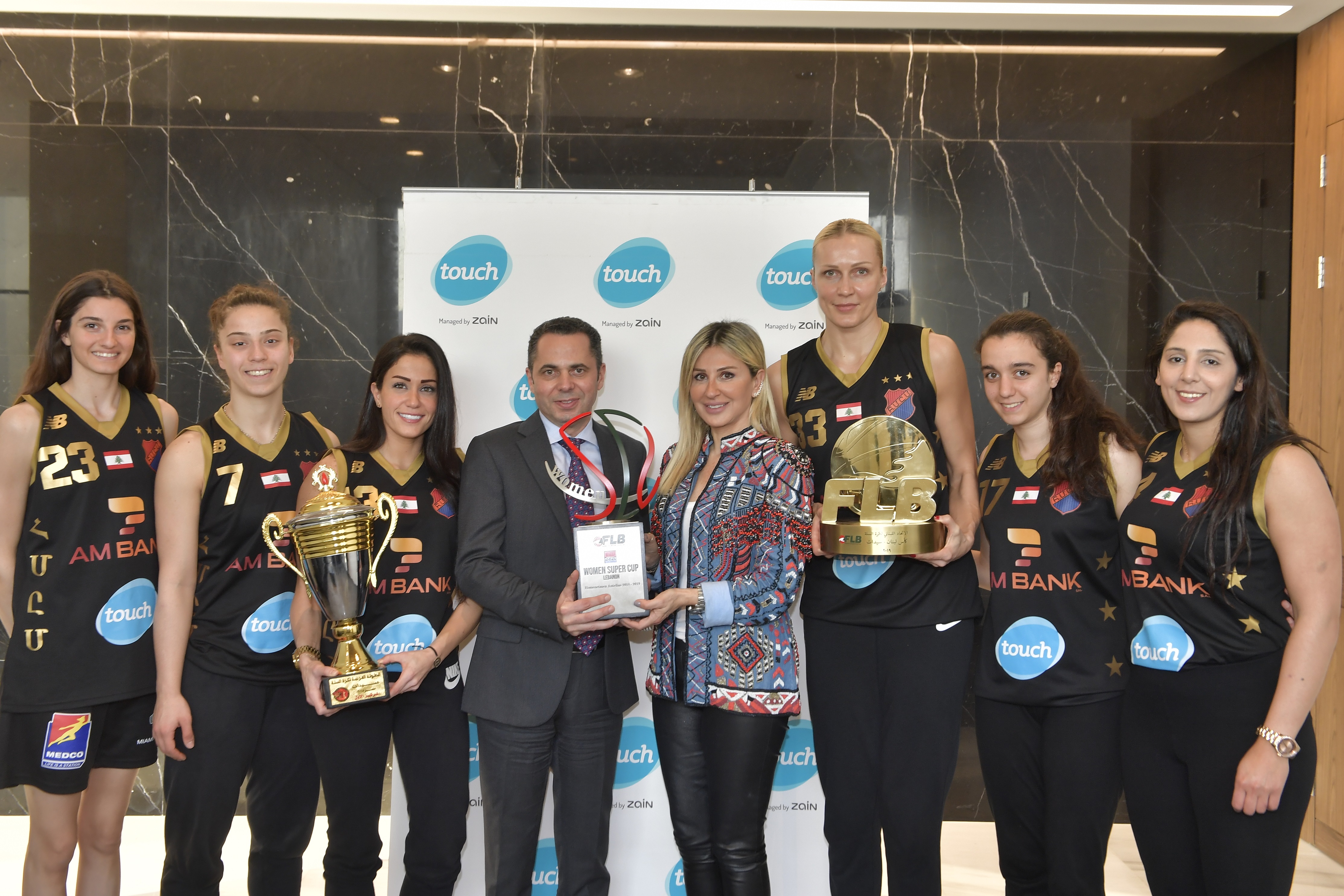 touch and Homenetmen Women’s Basketball team celebrate winning three trophies this season